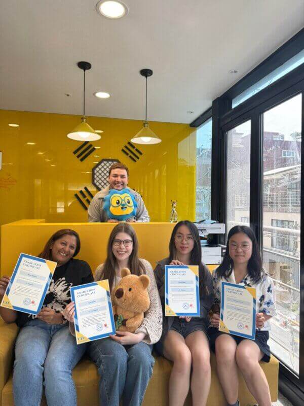 Raissa and Anne graduates from small group Korean classes with Manu